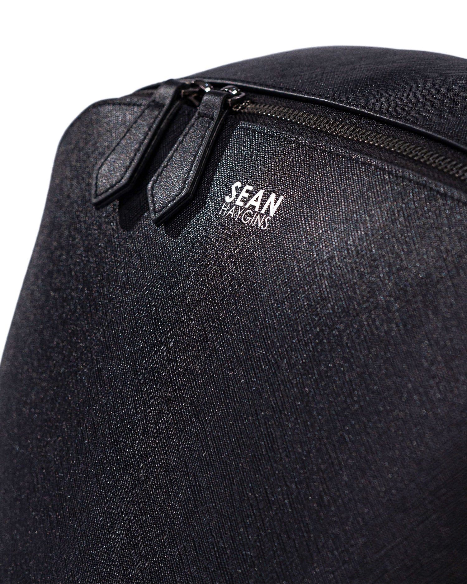 Black backpack with 'Sean' logo on a white background