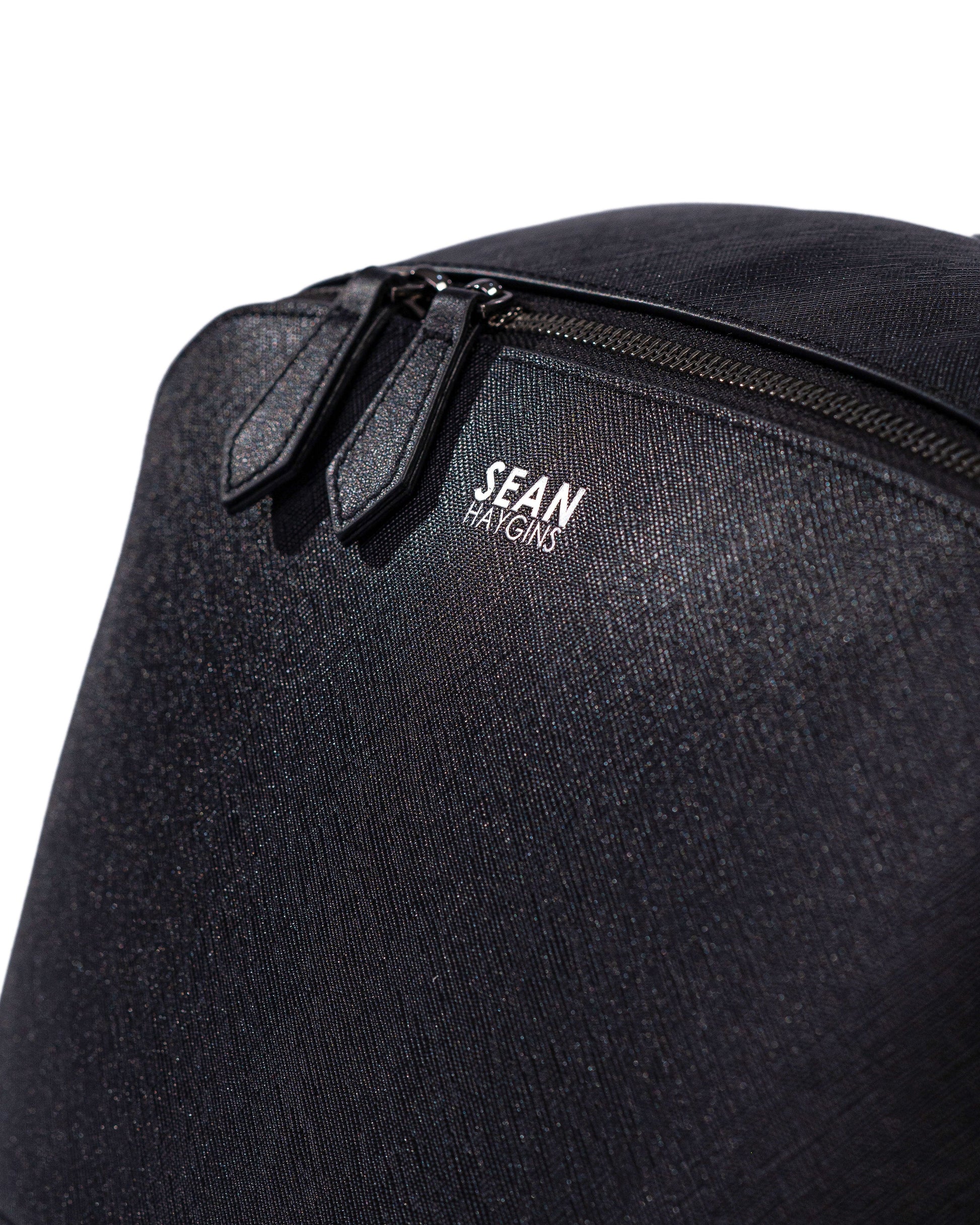 Black backpack with 'Sean' logo on a white background