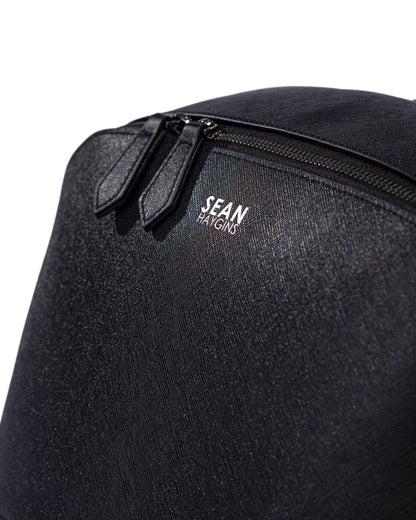Black backpack with 'Sean' logo on a white background