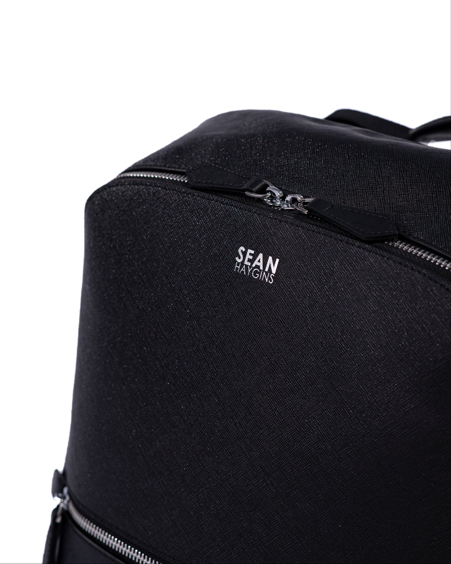 Black backpack with 'Sean Kington' branding on a white background