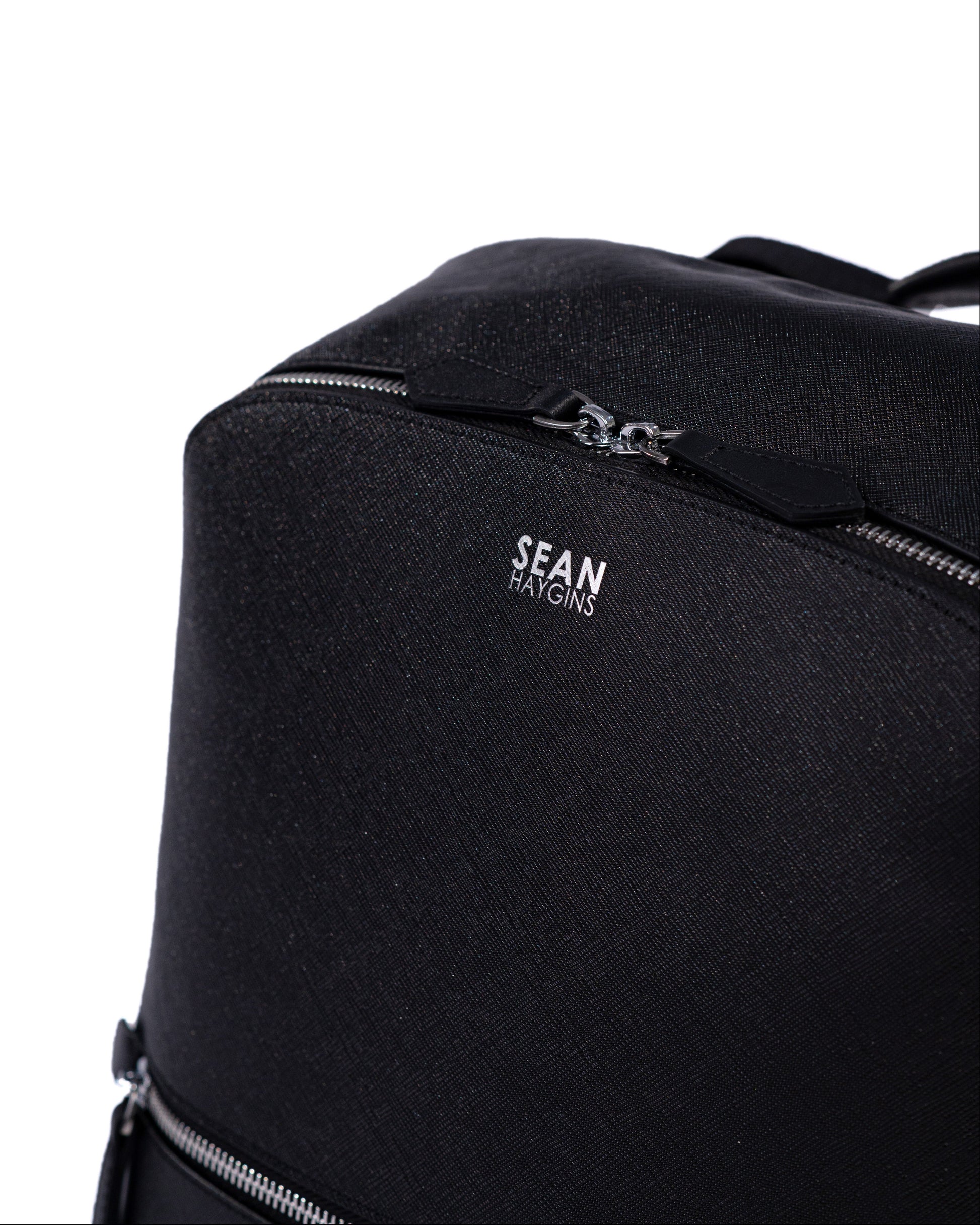 Black backpack with 'Sean Kington' branding on a white background