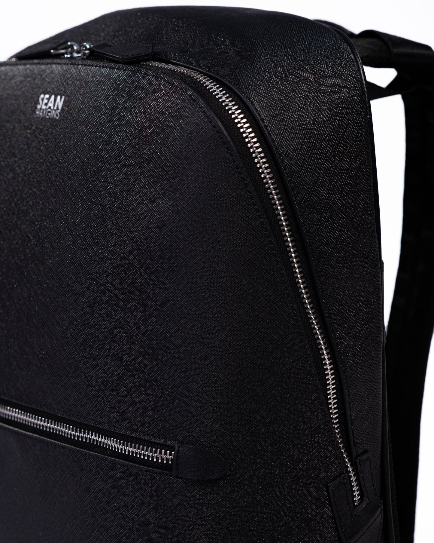 Black backpack with a visible brand logo on a white background