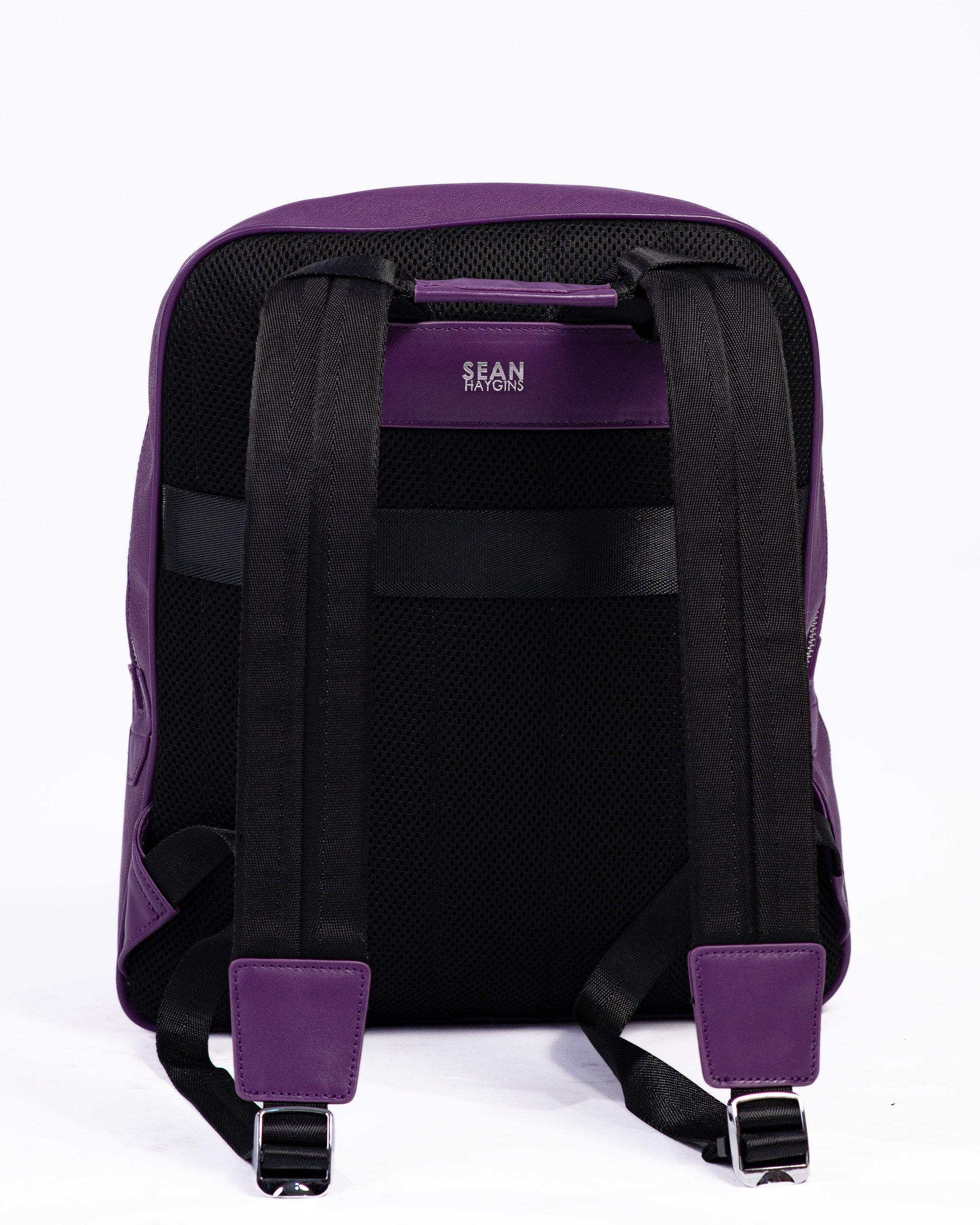 Purple backpack with visible brand logo on a white background