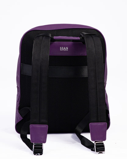 Purple backpack with visible brand logo on a white background