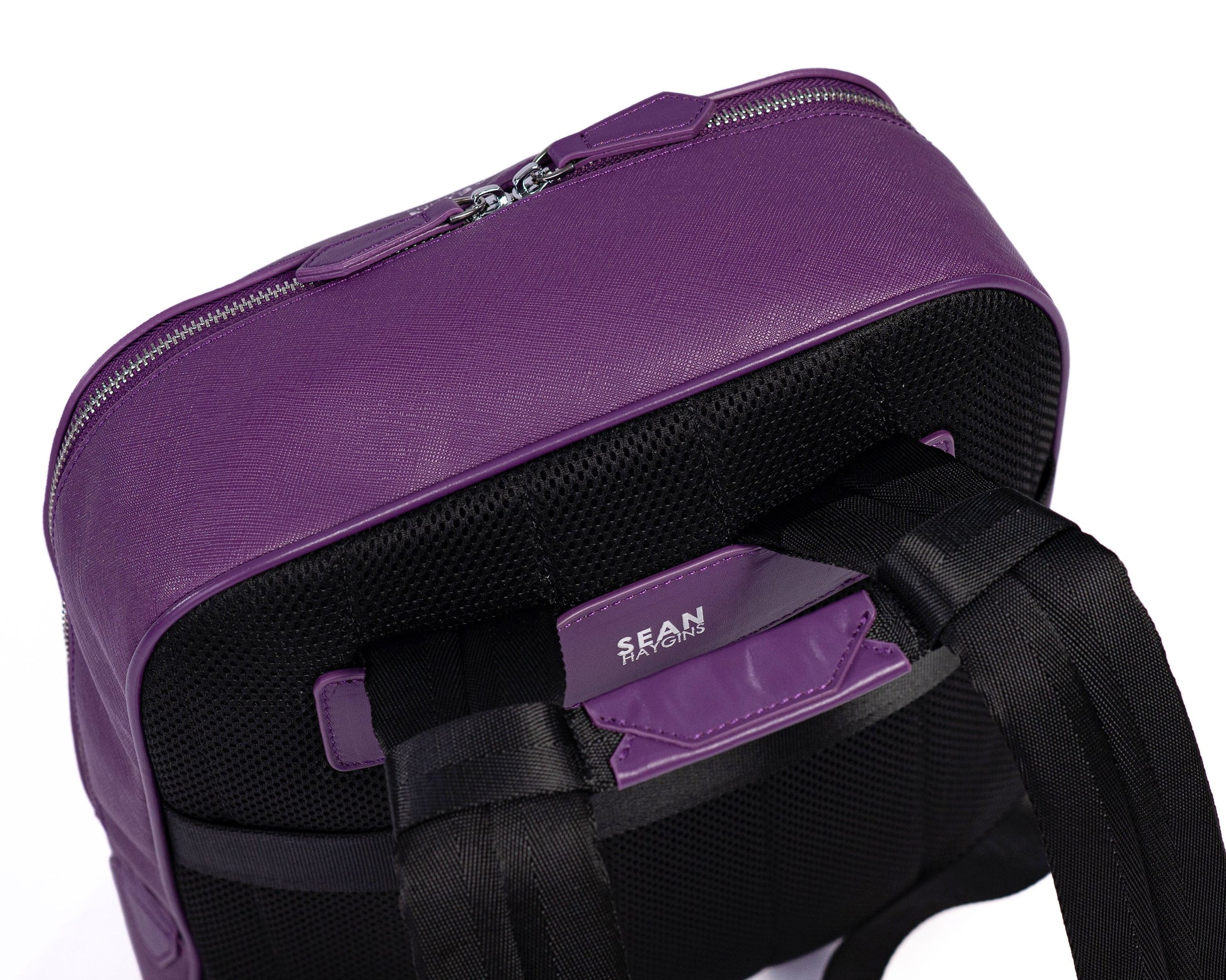 Purple backpack with a visible brand name on a white background