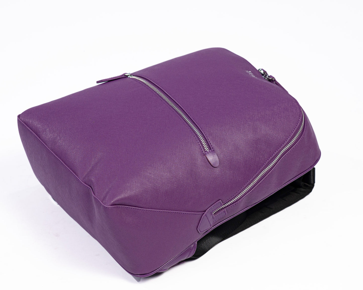 Purple leather bag on a white background