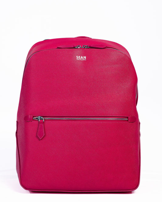 Pink backpack on a white background