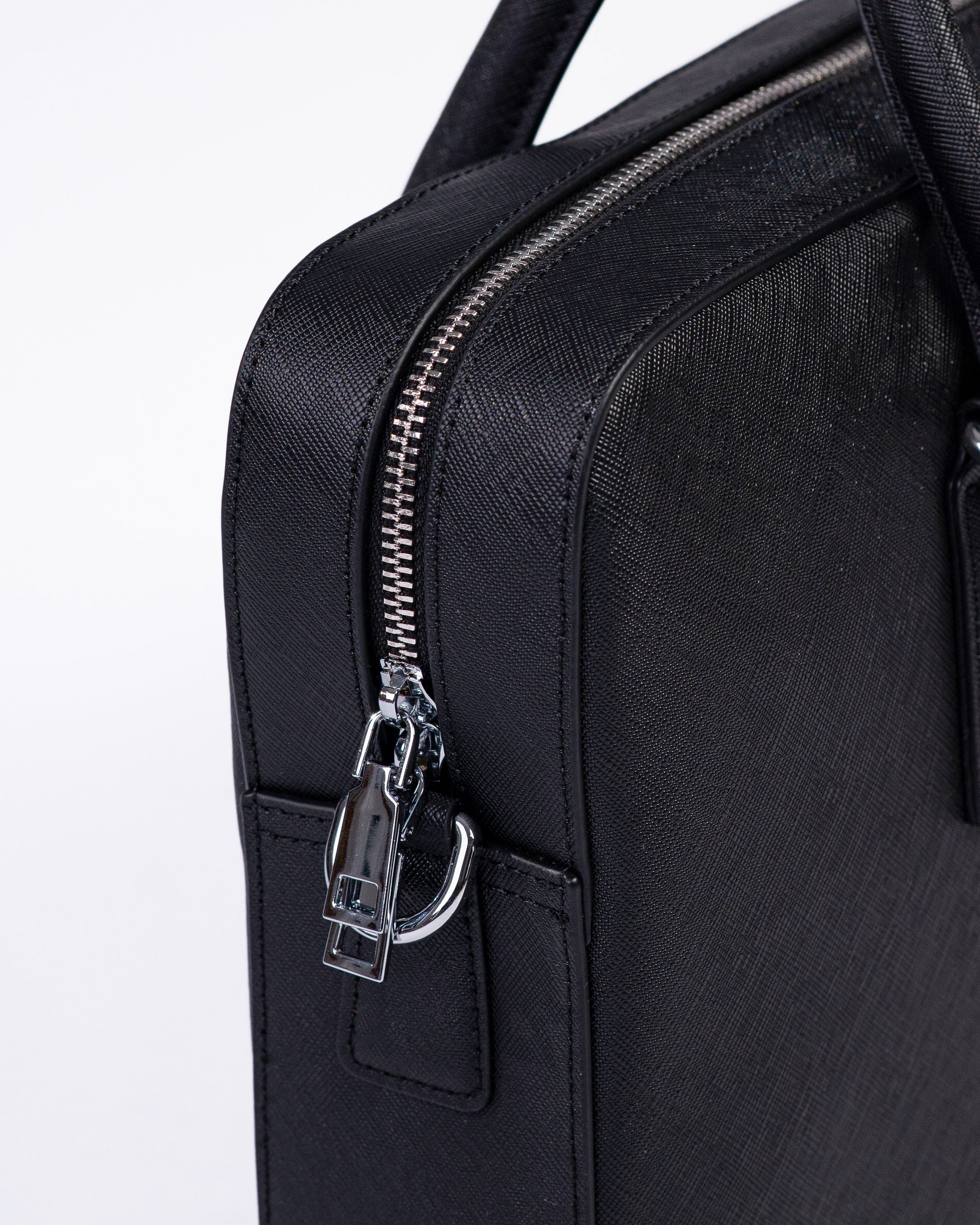 Black leather briefcase with zipper on a white background