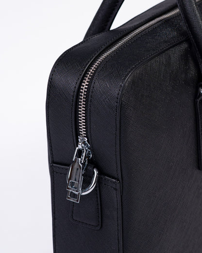 Black leather briefcase with zipper on a white background