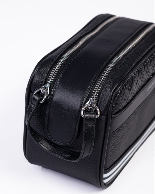 Black leather toiletry bag with zipper on a white background
