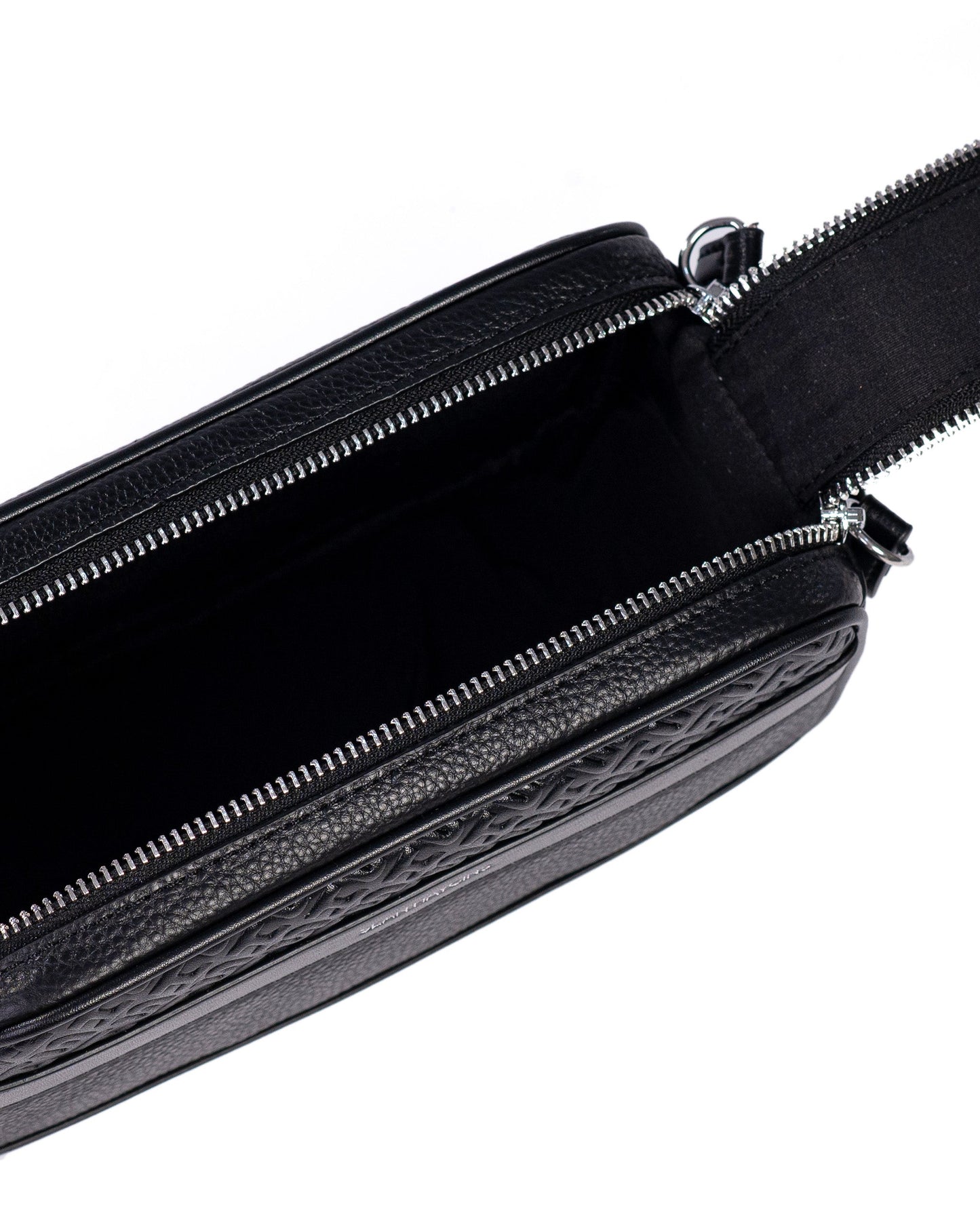 Black leather bag with a strap on a white background