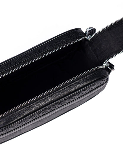 Black leather bag with a strap on a white background