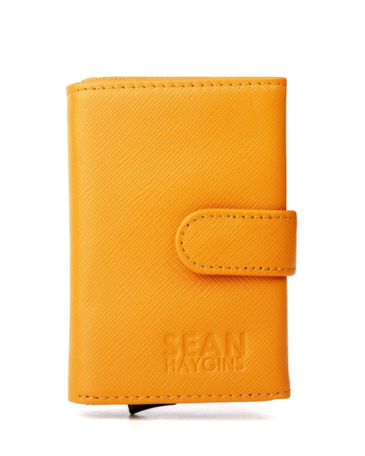 Orange wallet with 'Sean Haygins' branding on a white background